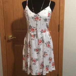 New with tags sundress from H & M cream colored with flowers and elastic back